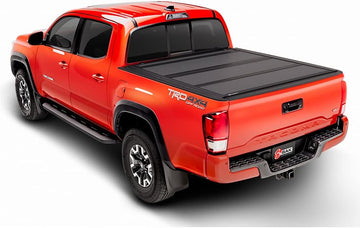 BAK Industries 448538 BAKFlip MX4 Hard Folding Tonneau Cover Fits Nissan Frontier, Black